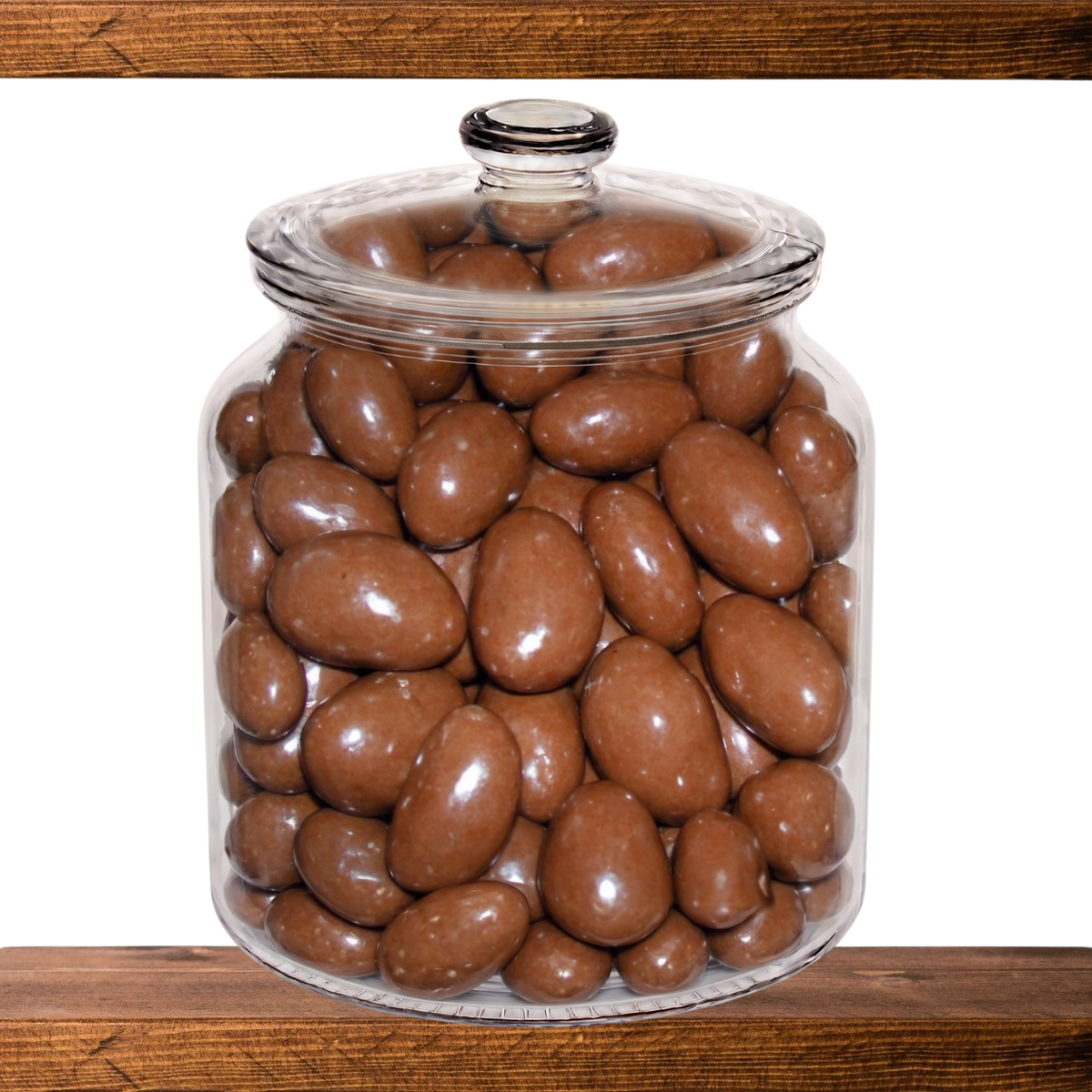 Chocolate Brazil Nuts in a glass sweet jar on the shelf at Mr Swainstons